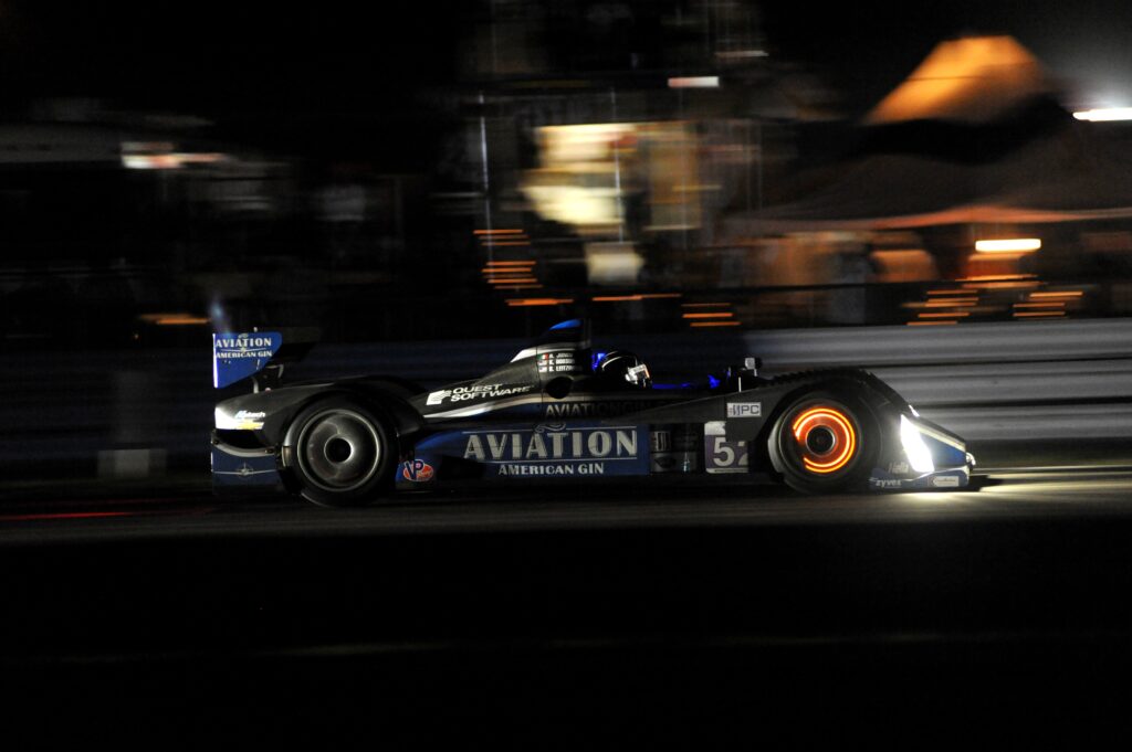 Race car with red-hot glowing front brake discs after hard braking
