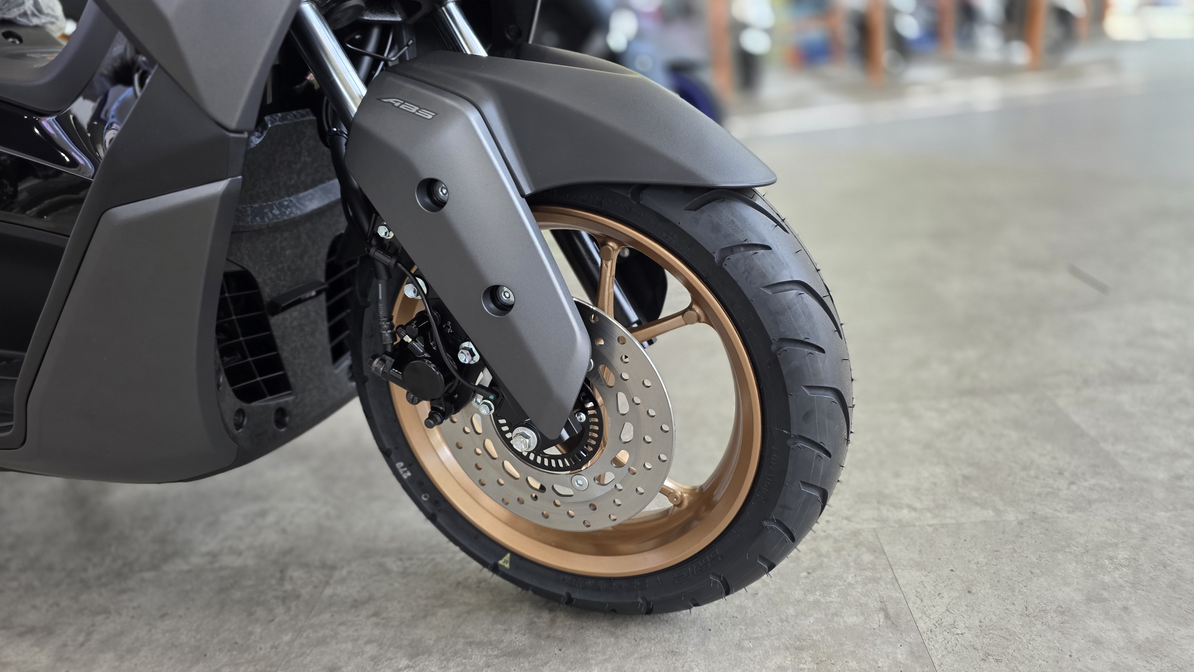 Front disc brake on a Yamaha NMAX scooter