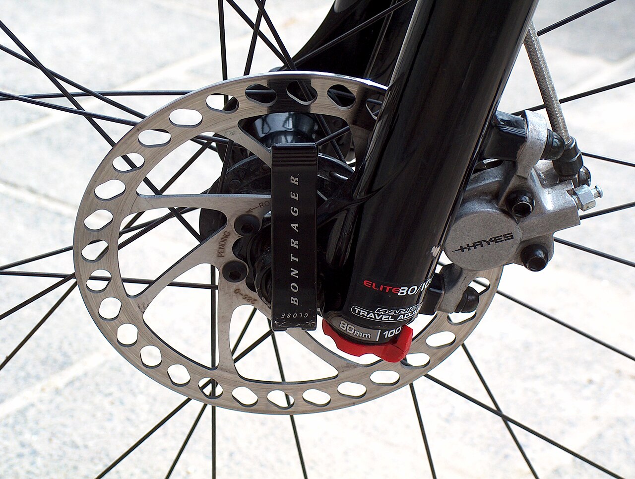 Bicycle disc brake caliper and rotor on a bike wheel